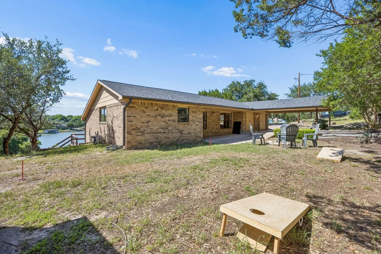 Exterior view of Happy Harbor Hideaway and the yard.