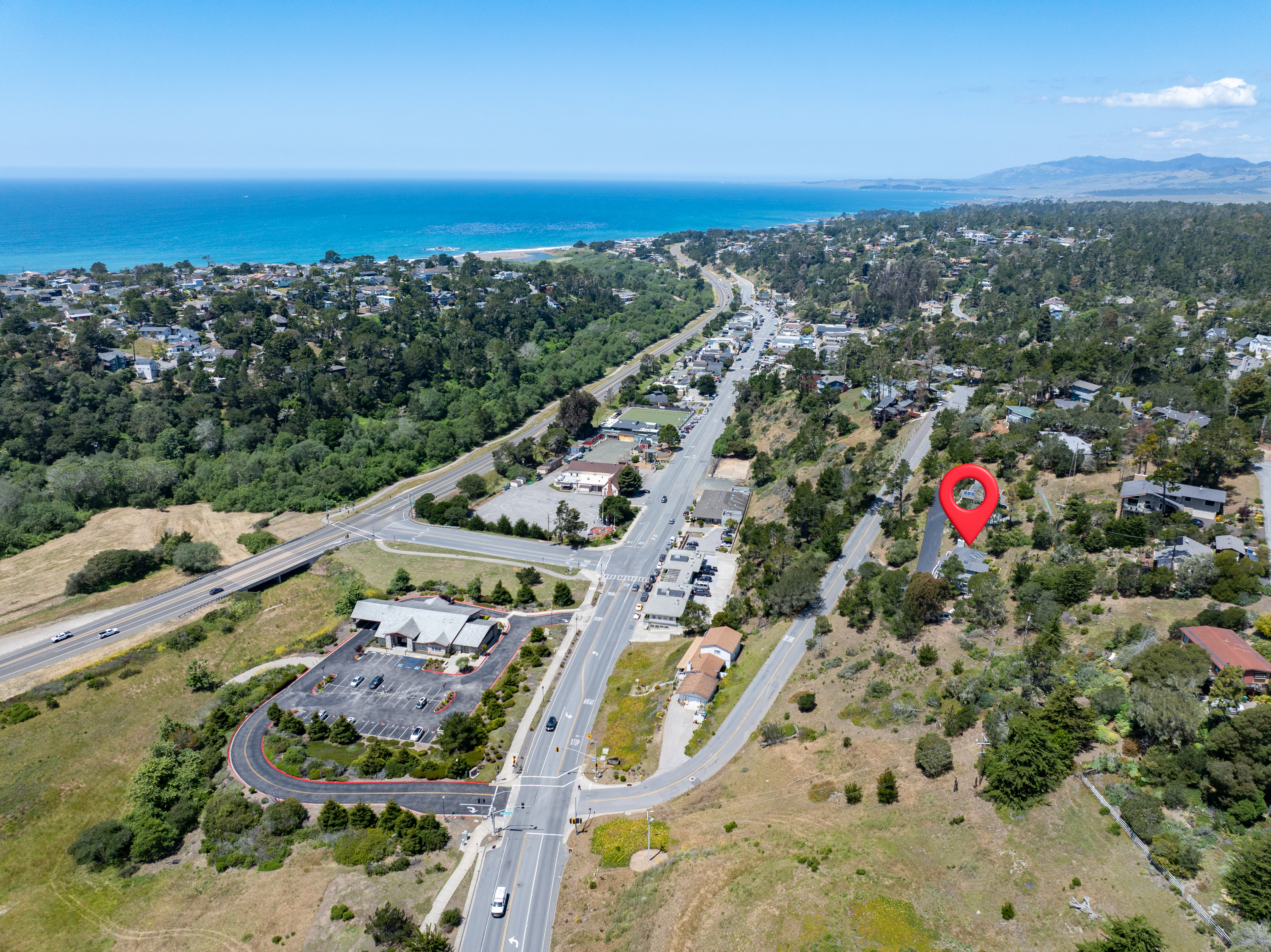 Elevated hillside retreat overlooking the coast and downtown.