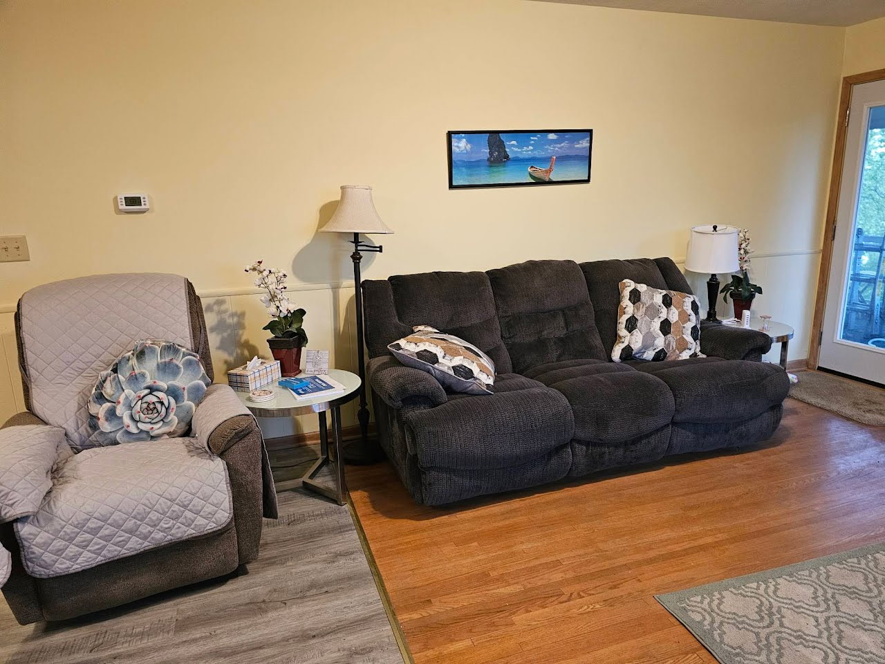 Couch, recliner, and access to 3 season porch
