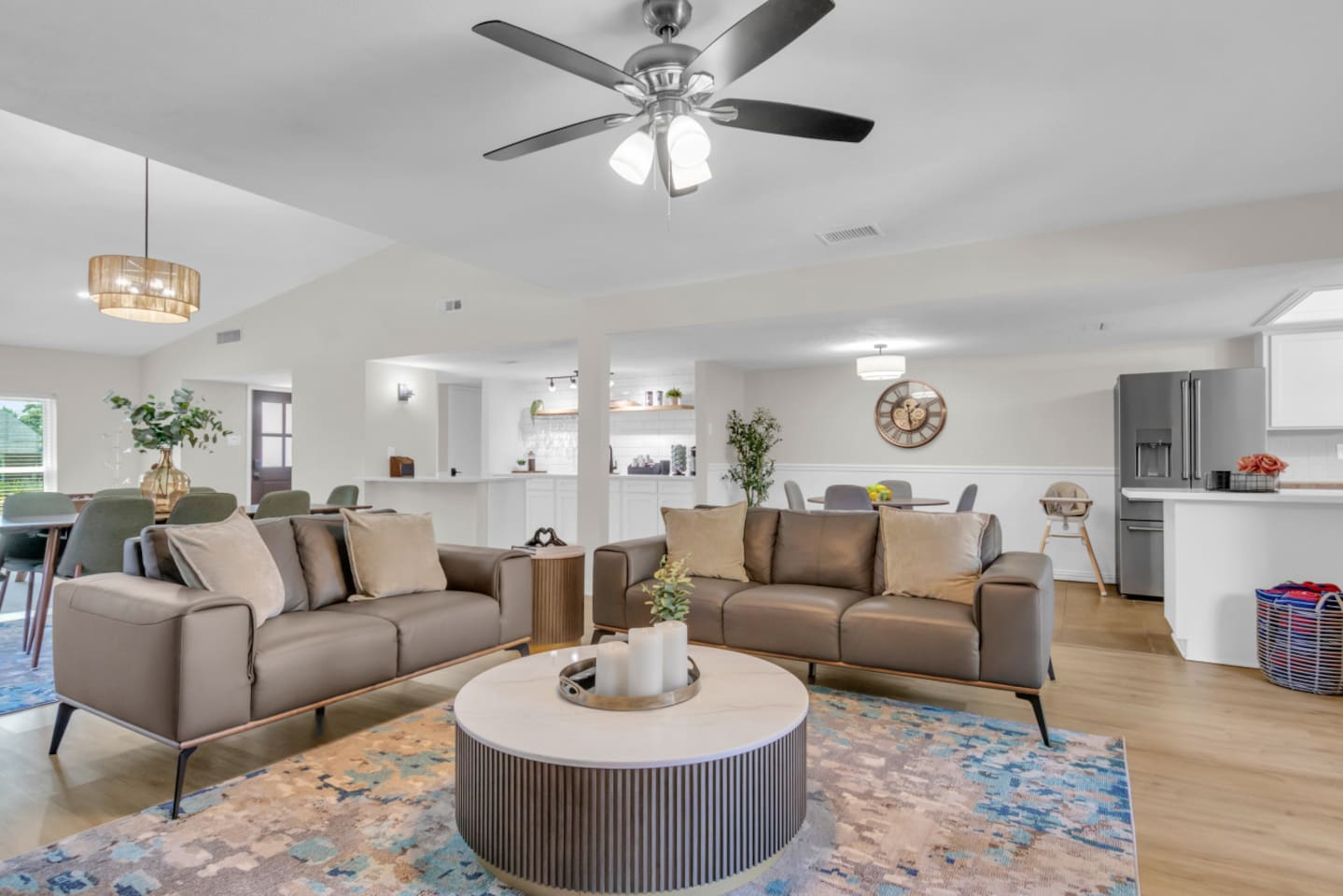 Relax in a spacious living room with ample seating and a large smart TV for movie nights