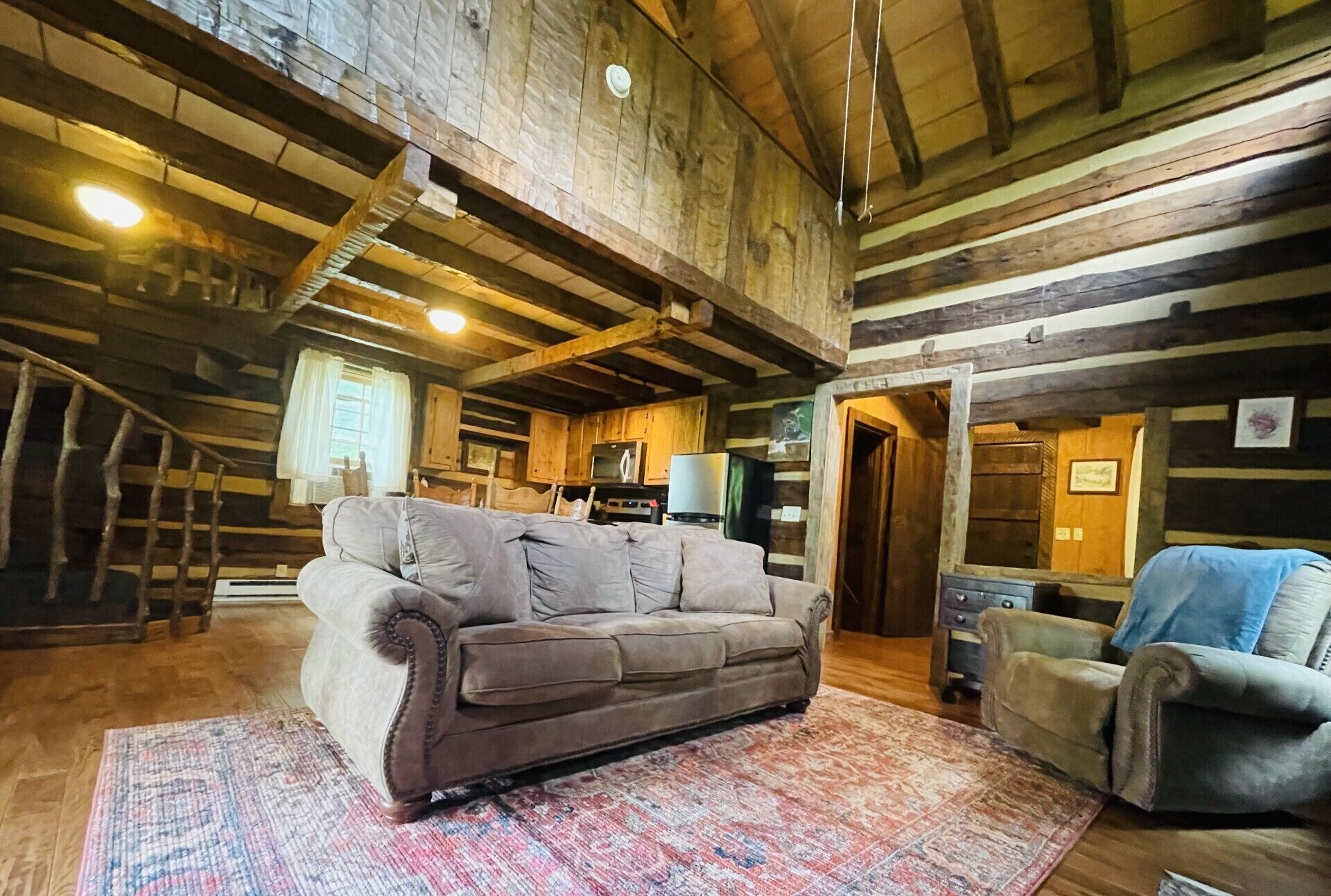 From this photo you can see loft above, dining and kitchen behind living area. 