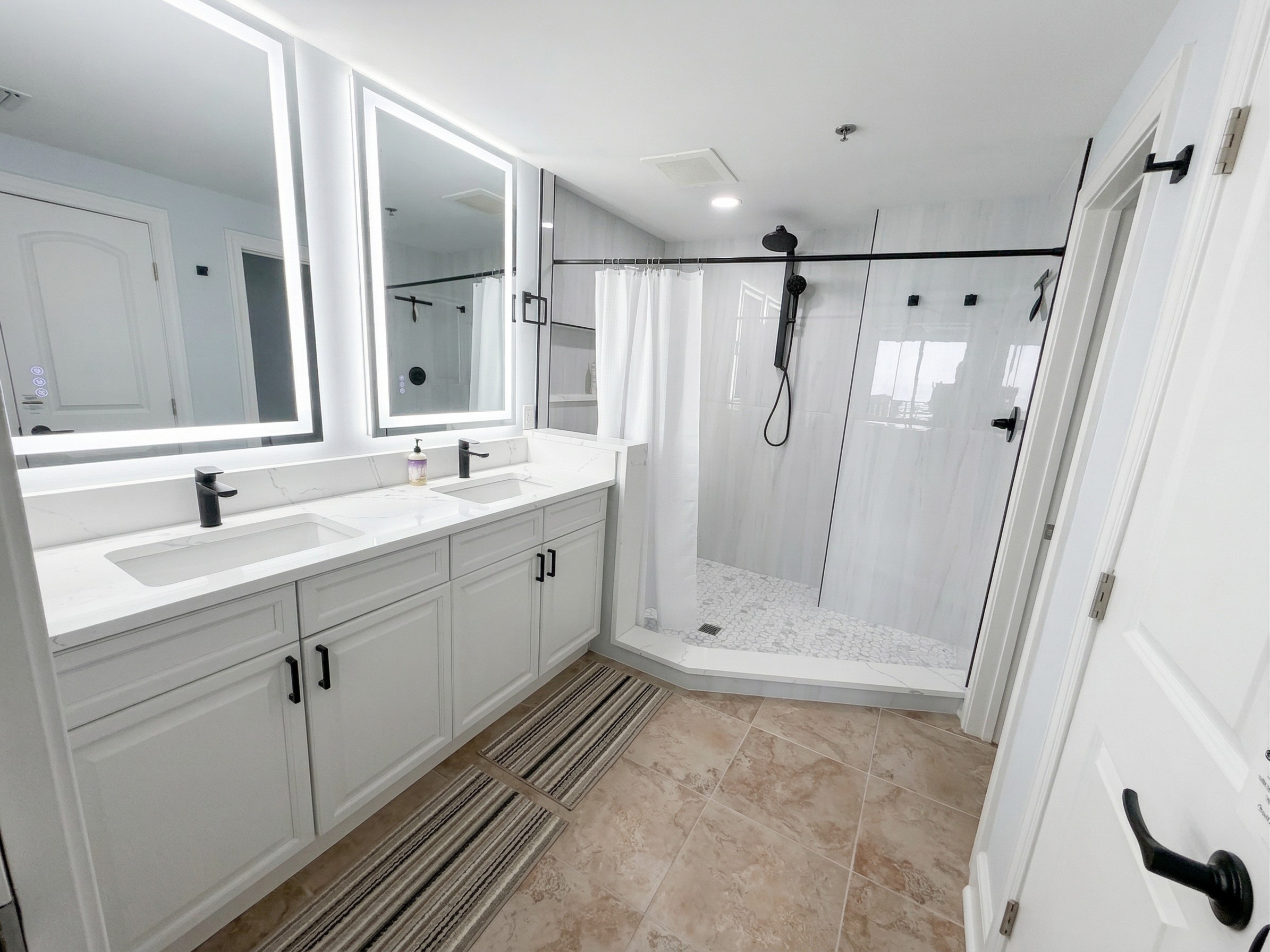 Start your day with plenty of space—double sinks, bright lighting, and a large walk-in tiled shower make mornings easy for everyone.
