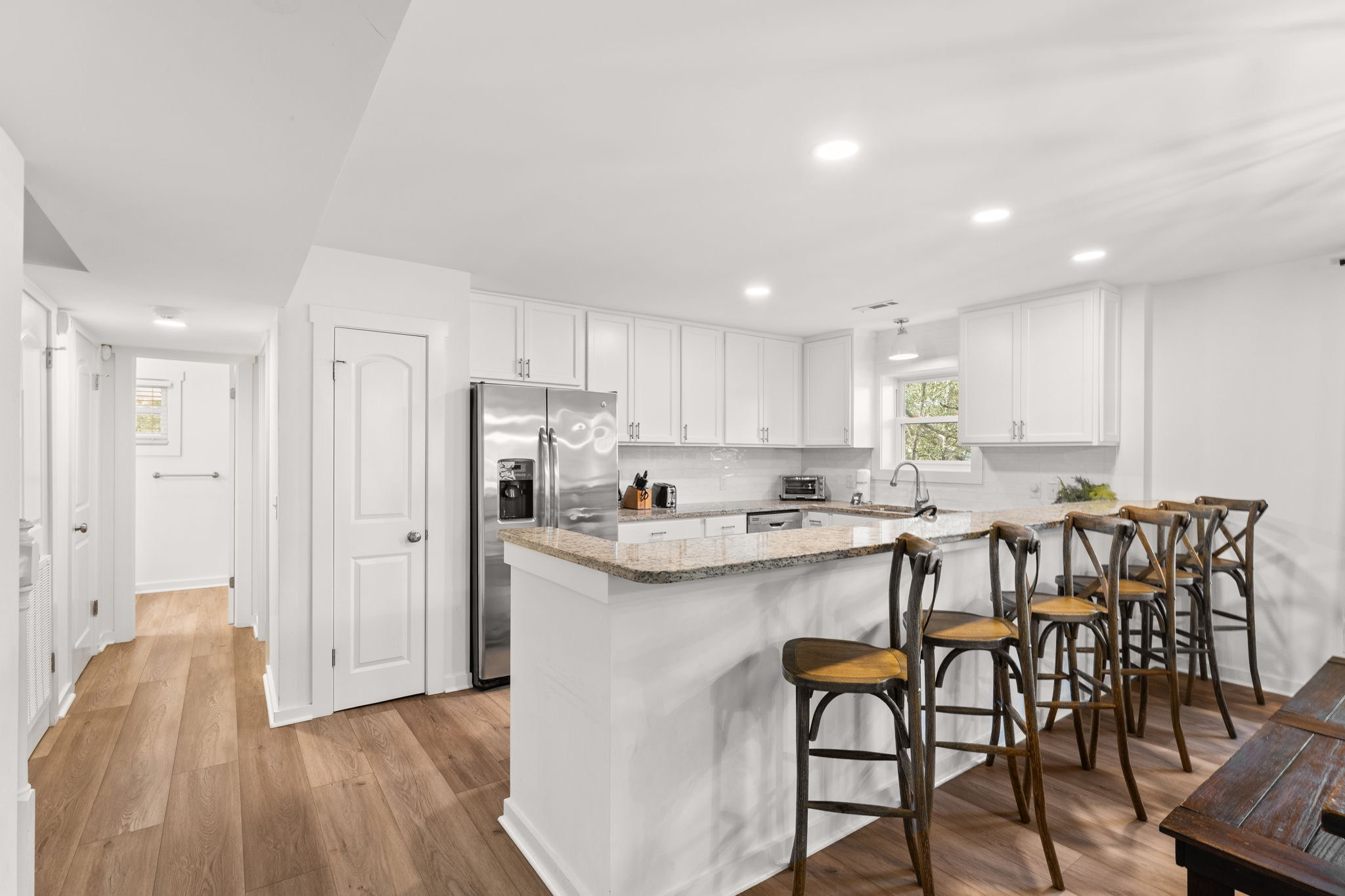 Side A: Sleek 2nd-floor kitchen and dining area—perfect for large family meals.
