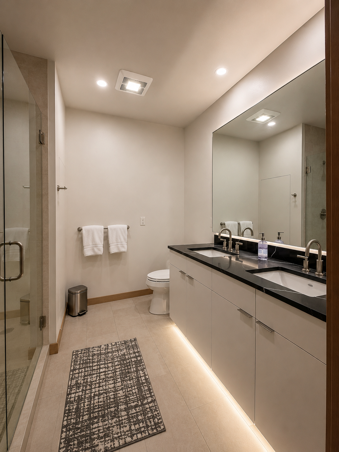 Spa-inspired bathroom featuring a dual-sink vanity, quartz countertops, matte black fixtures.