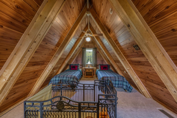 Cozy up in the charming attic bedroom, featuring two single beds — a perfect, peaceful retreat for friends or family!