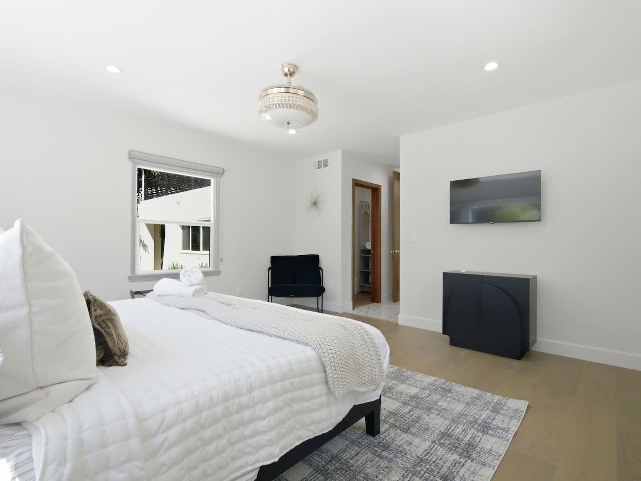 A picture-perfect bedroom with cozy comforts and stylish touches for a memorable getaway.