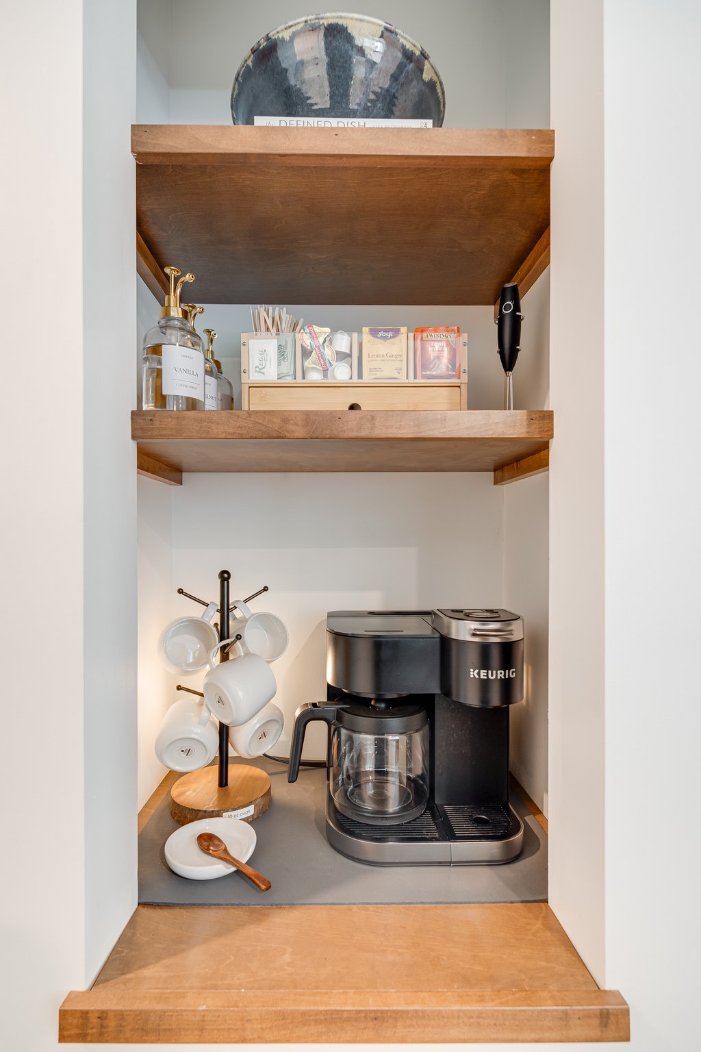 Enjoy a Keurig that brews single pods & full pots, perfect for solo sips or group mornings. Guests enjoy a starter set of complimentary coffee, tea, & flavored syrups to craft the perfect cup.