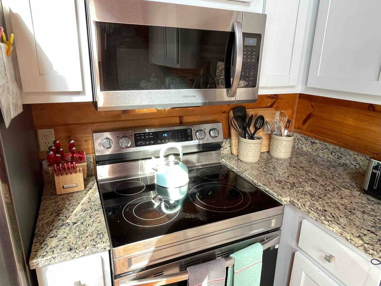 Kitchen stocked with pots, pans, and many utensils