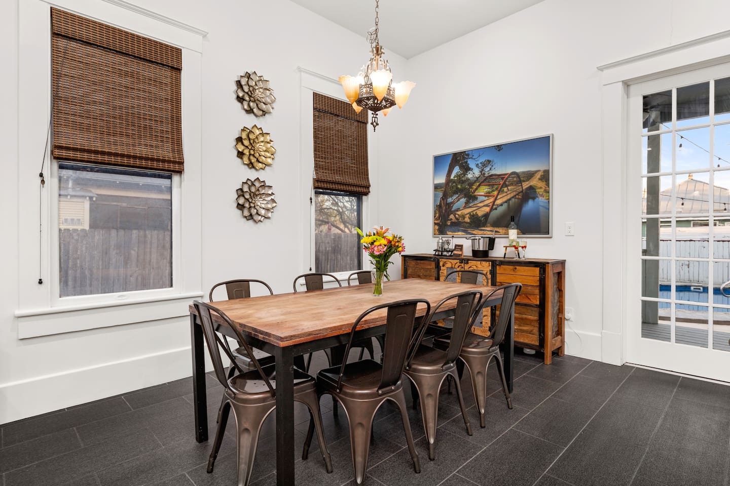 Enjoy family feasts and intimate dinners alike in our dining room, where warmth and elegance come together under the soft glow of a chandelier.