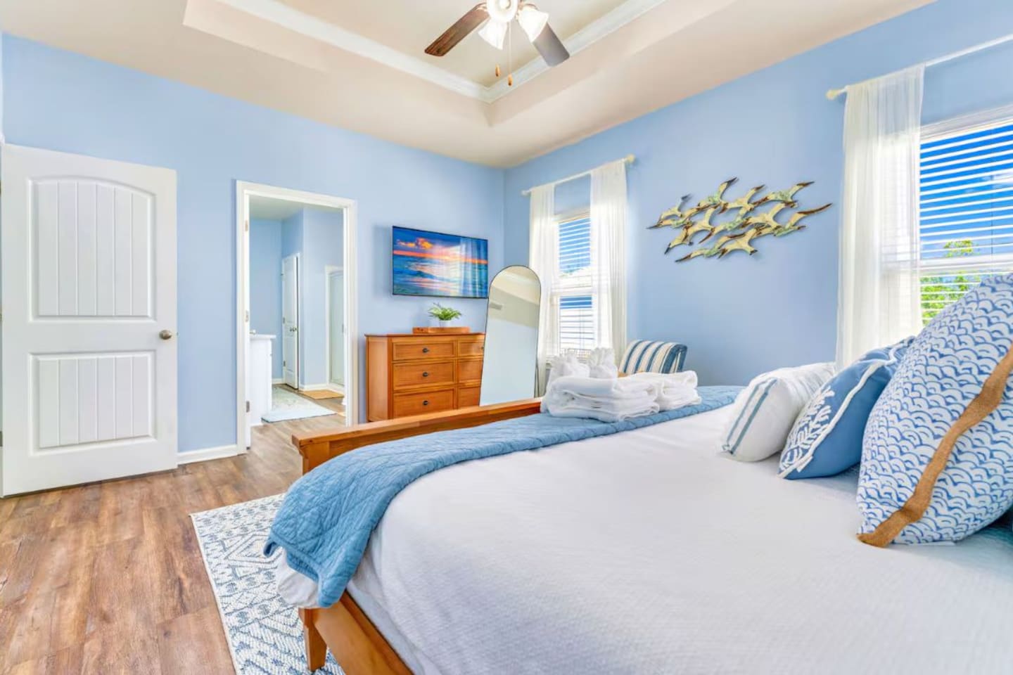 Wake up in a serene space complete with plush bedding and calming beach-house touches