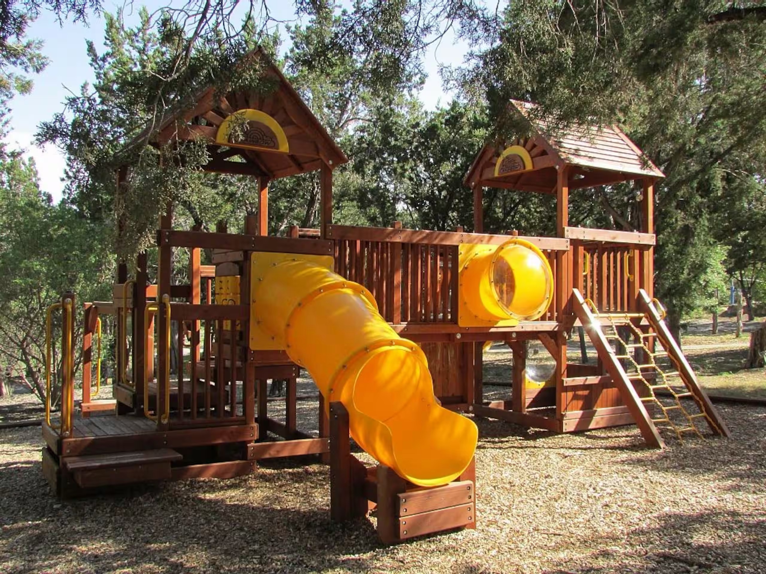 Beach Club playground and green space give kids room to play.