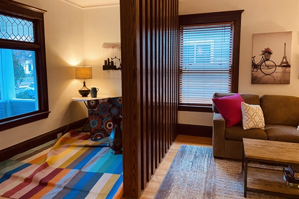 Sunroom/porch adjacent to living room.