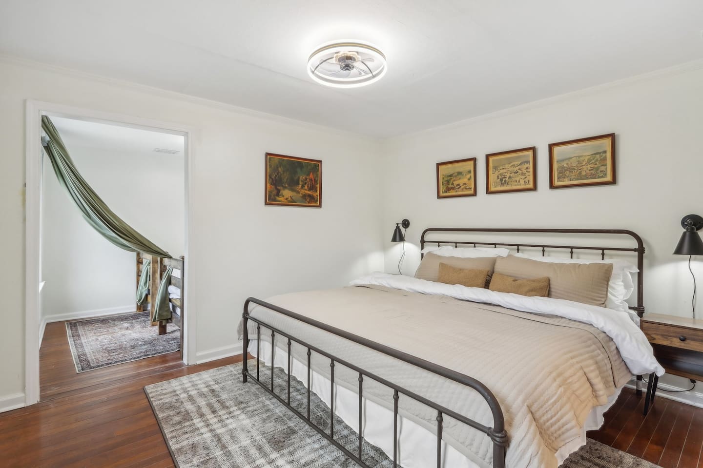 Recharge in Bedroom 1, featuring a comfortable king-size bed, soft neutral tones, and a calm setting for a restful night.