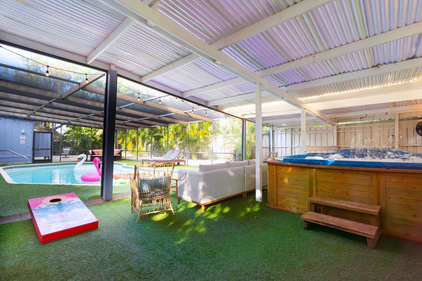 Screened Saltwater Pool with artificial non slip turf. Hot Tub, Ping Pong, Bucket Ball, & Corn Hole.