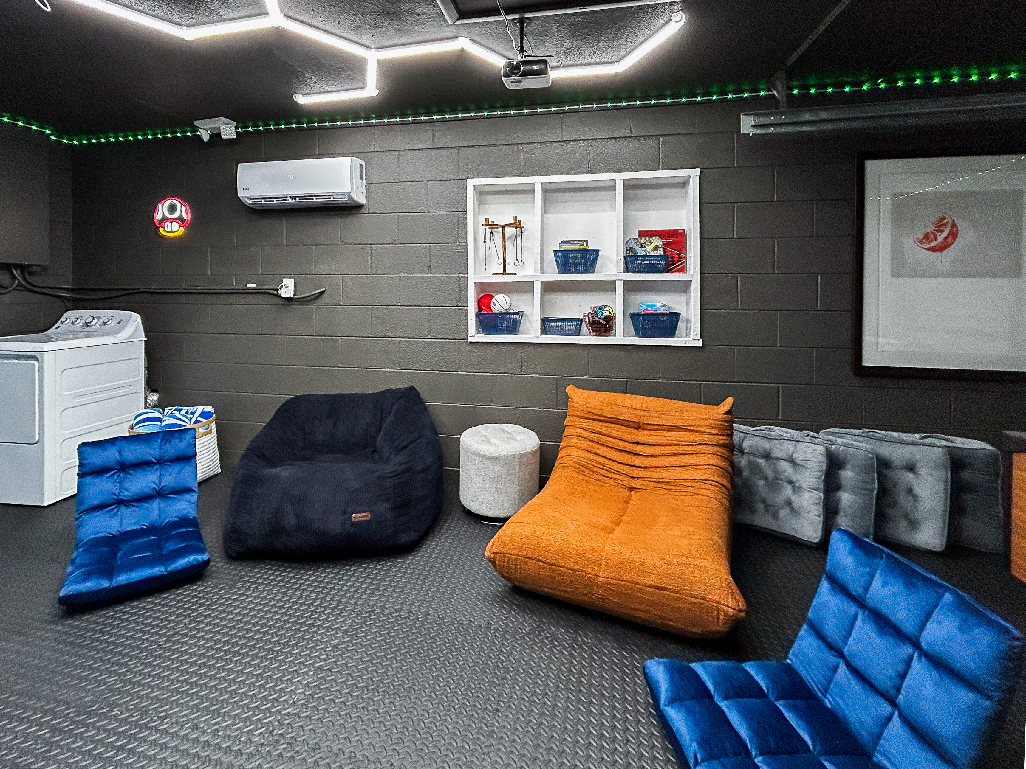 Garage Game Room Air Conditioned with Foosball, Nintendo Switch with Mario Kart, Just Dance & more. Comfortable Seating, Foam Mat Flooring, LED Lights, Mini Basketball, Games, Books & More