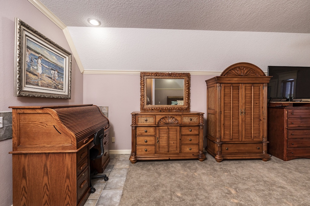 primary bedroom with king bed, en suite bathroom, private balcony and desk