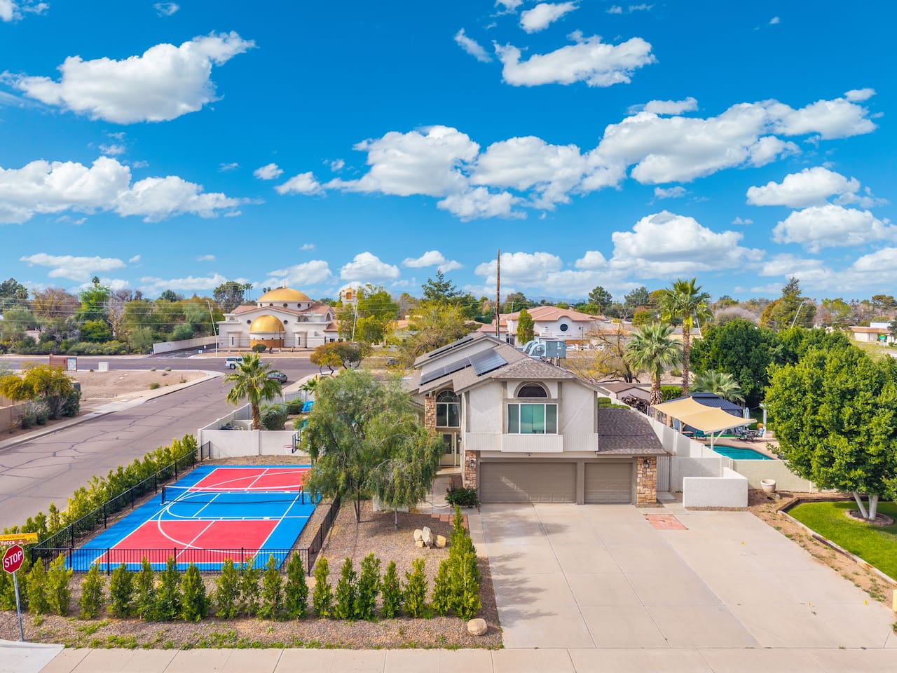 Your own sport court sets the stage for game days, with a refreshing pool just steps away.