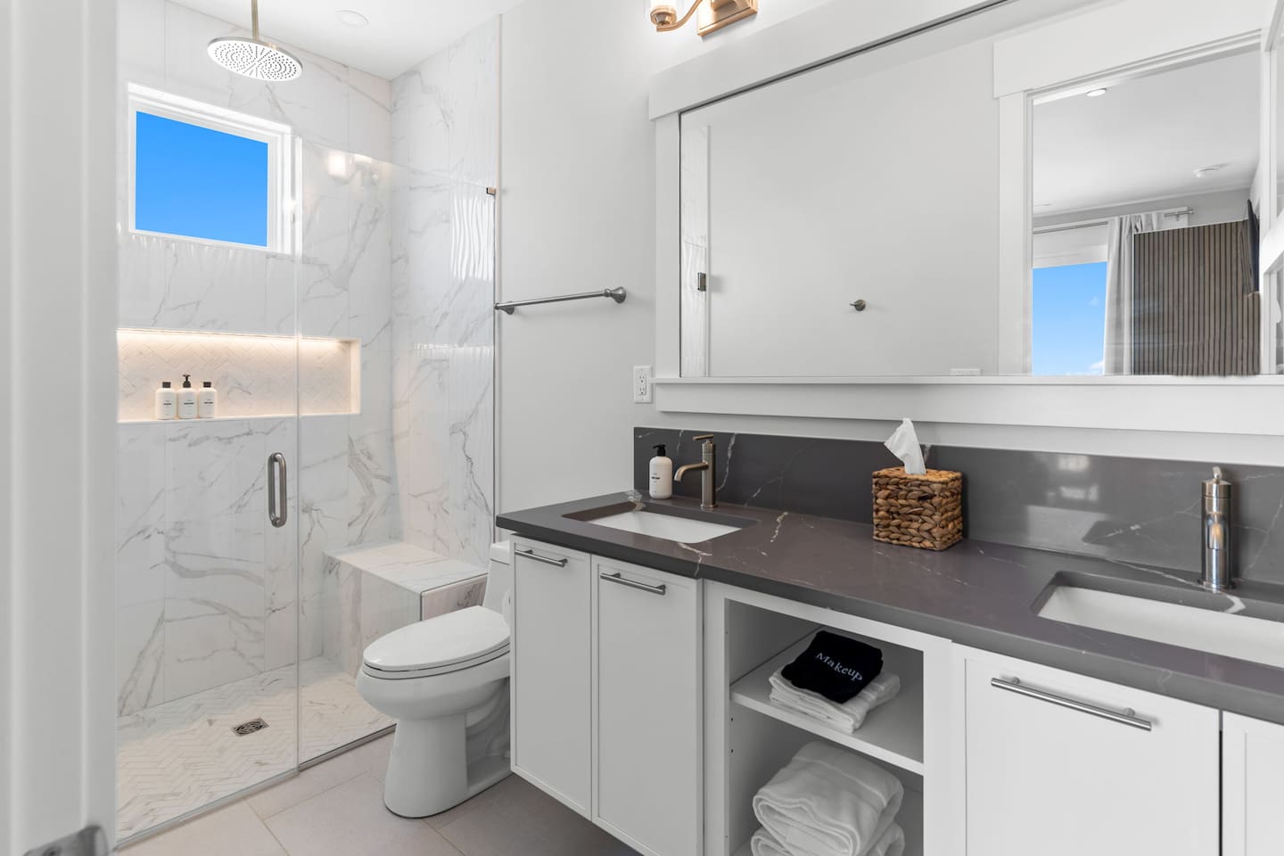 Thoughtfully designed for every guest, each bathroom features spacious curbless showers with built-in benches, blending accessibility with modern comfort and style.