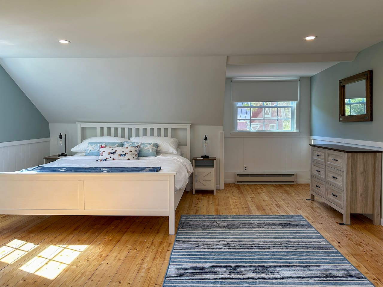 The primary bedroom suite is accessed by a private staircase leading to a bedroom, bathroom, and workspace. 