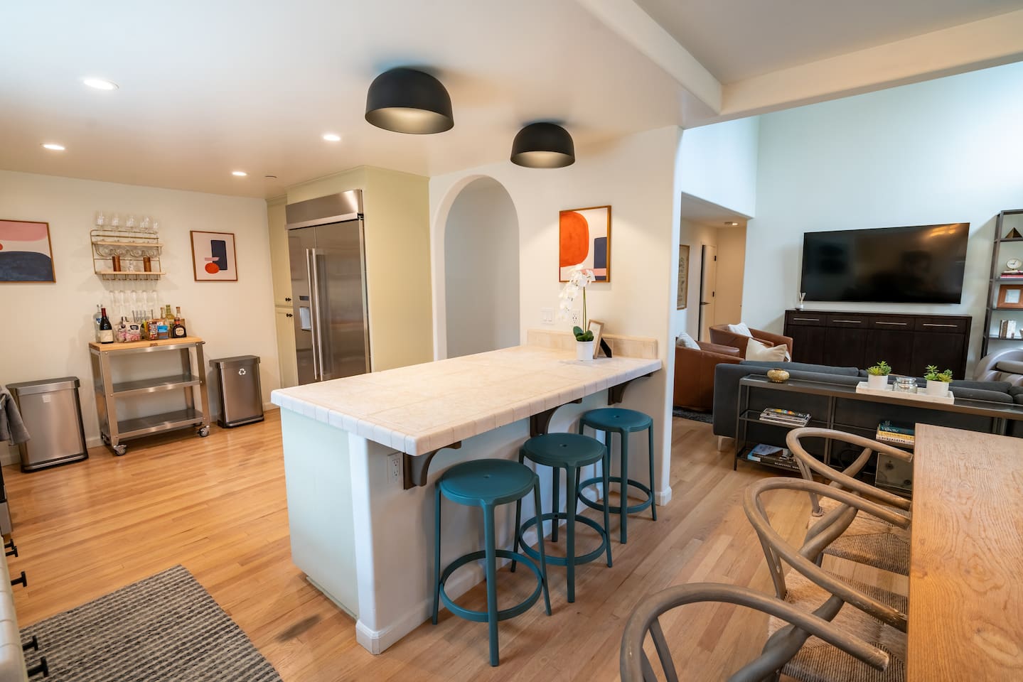 Full stocked kitchen with island seating for three