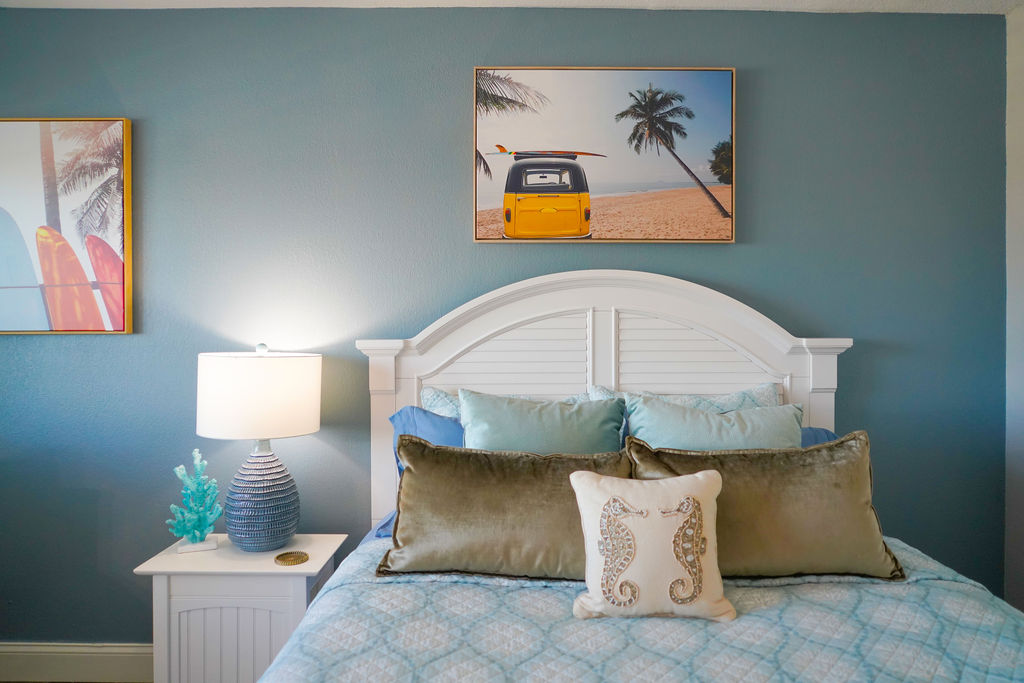 Charming coastal-themed Queen bedroom in this beachfront vacation rental offering stylish comfort and a relaxing seaside vibe.