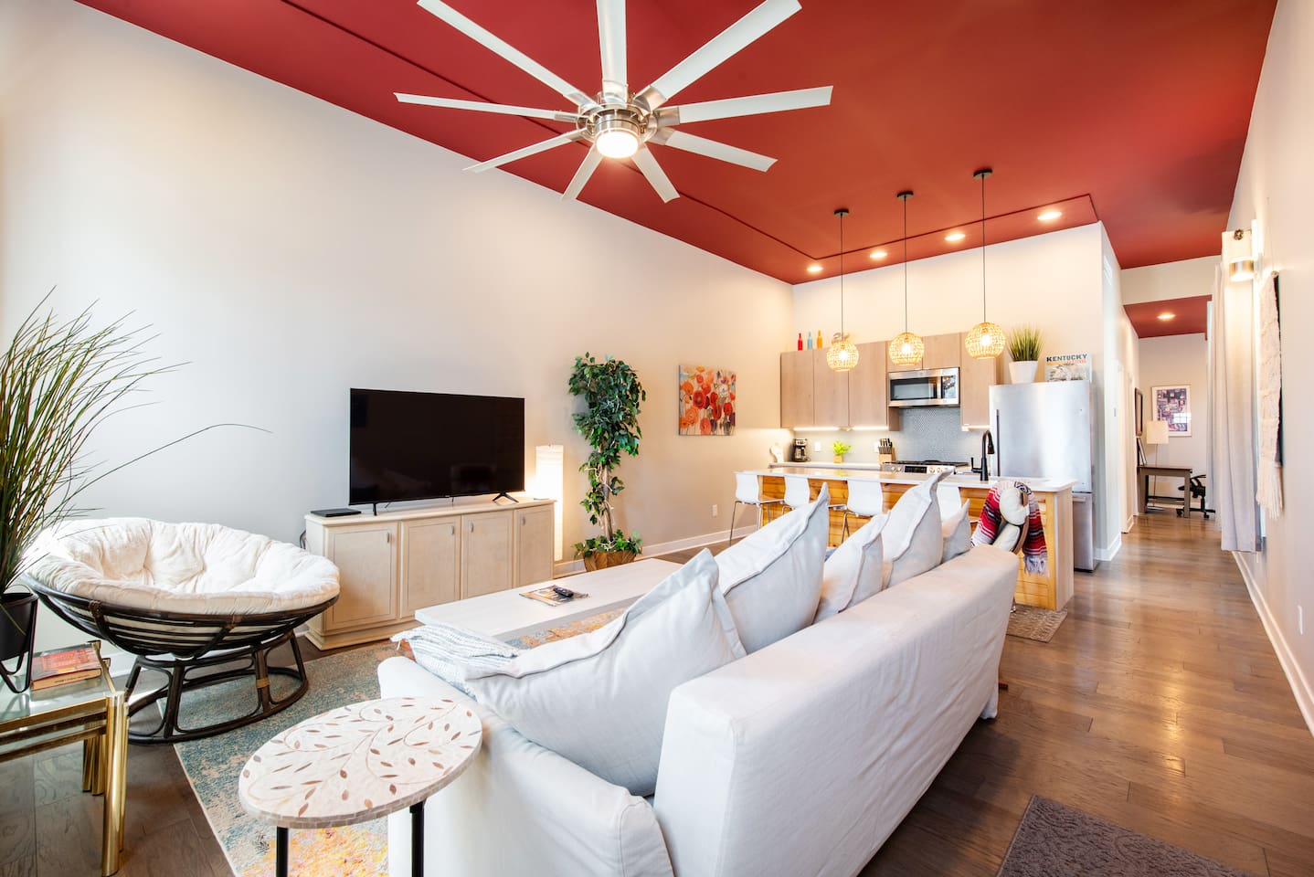 Open living concept. Tall ceilings, lots of natural light. Sleeper sofa and windows have black out curtains. 