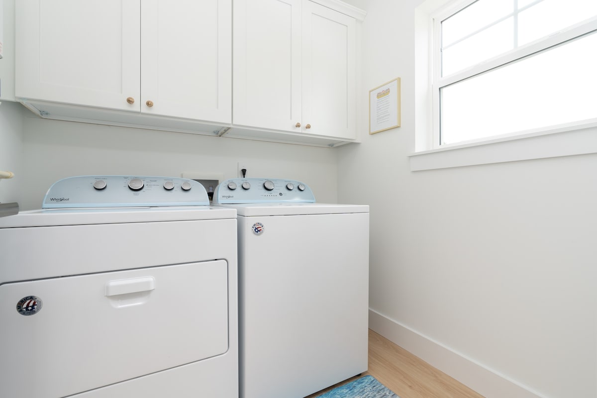 A full-size washer and dryer in a room of their own, which is quietly what makes a whole week here work. Sandy towels go straight in, everyone repacks lighter, and nobody drives home with a boot of damp swimsuits.