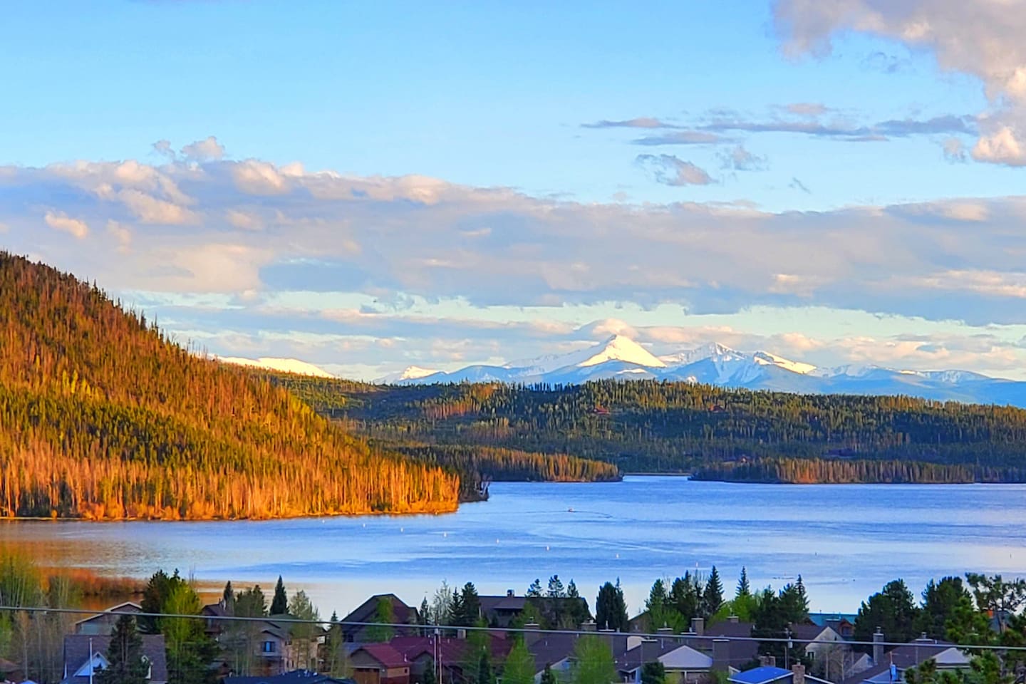 Summer view of Shadow Mountain Lake and mountains near Winter Park from the master bedroom and decks,