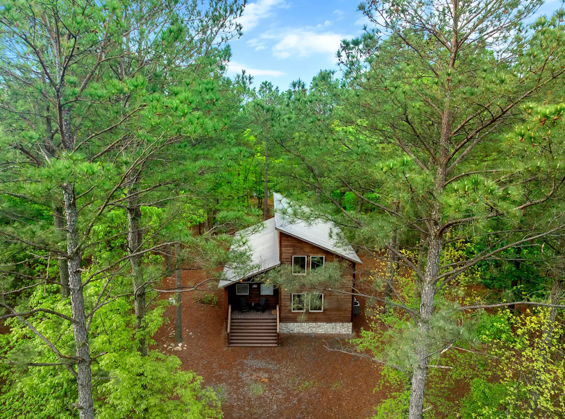 Peaceful woodland cabin surrounded by towering trees and natural beauty