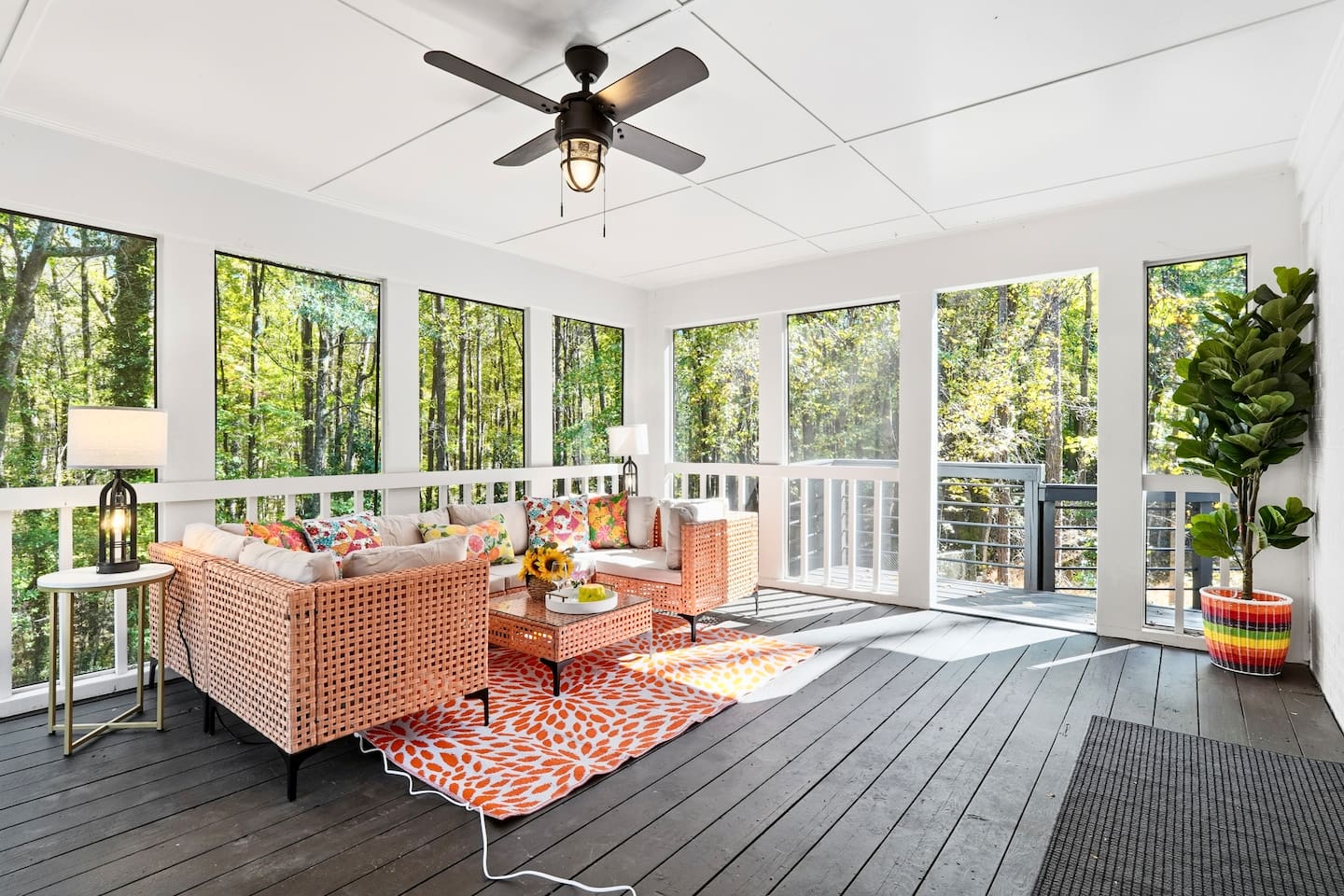 Cozy sunroom with warm orange tones, perfect for relaxing and soaking up the sunshine on bright days.