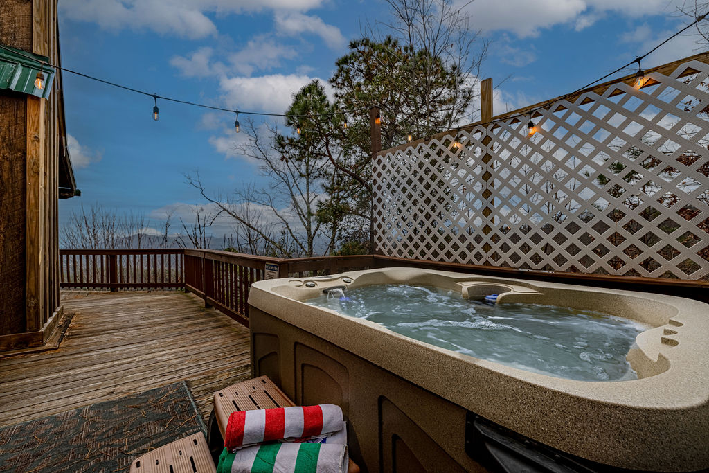 Soak in the bubbling hot tub while enjoying peaceful scenery