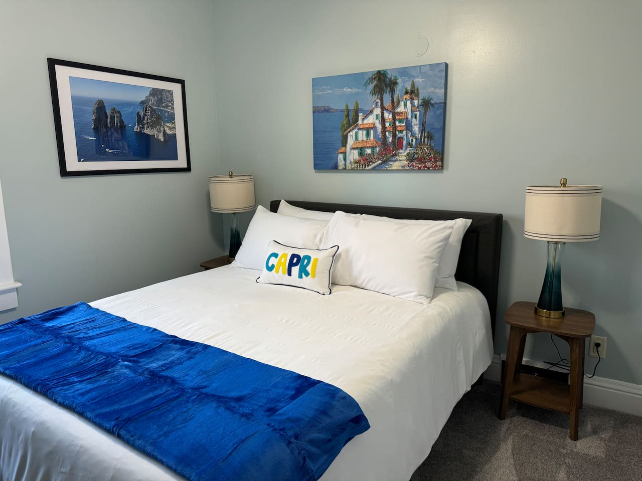 The Upper Level Capri Room offers Queen bed and Roku smart TV in a calm and relaxing setting.