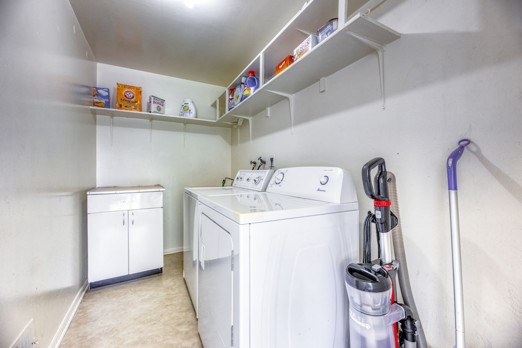 From the sunroom, walk into the private laundry room with full Washer and Dryer.  We provide starter supplies.