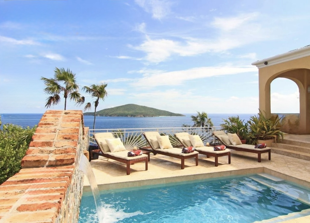 Private pool with loungers and sweeping Atlantic views—your front-row seat to Hans Lollik.