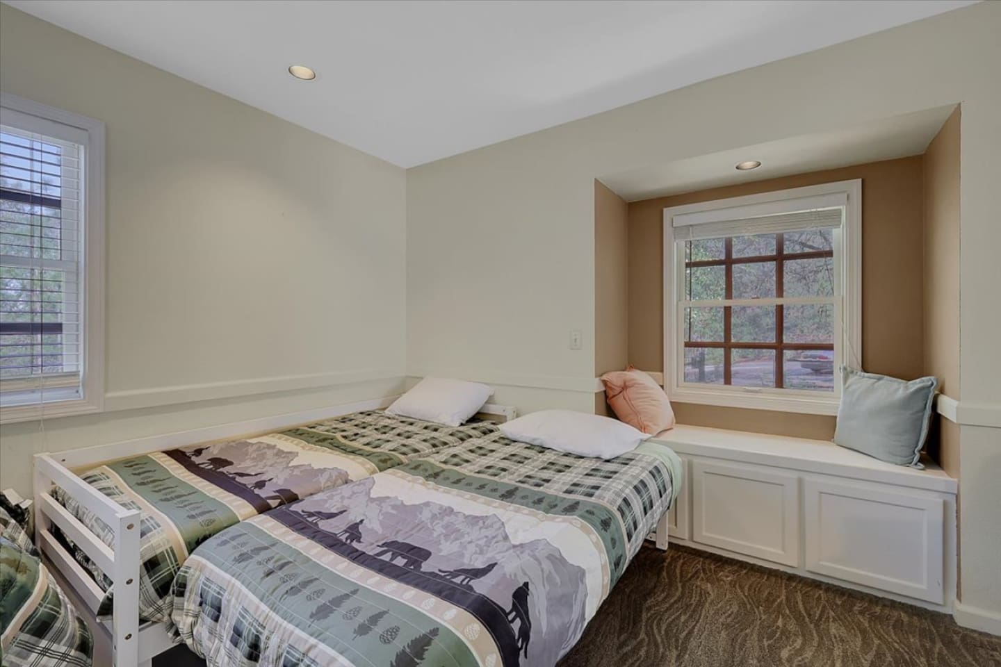 Bedroom 3 with three twin beds and a simple setup for kids, friends, or extra guests.
