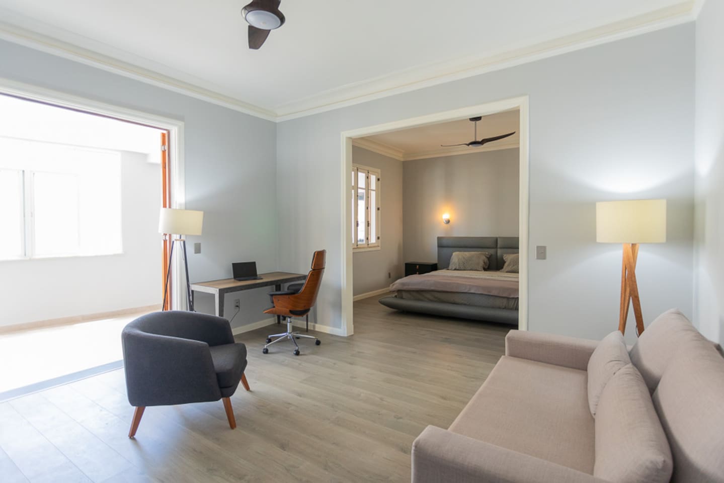 Primary bedroom, with large sitting room and pull out sleeping sofa.  French doors lead to covered terrace.  Ceiling fans and air conditioning in all bedrooms.  (Bedroom 1, with full size sleeper sofa).