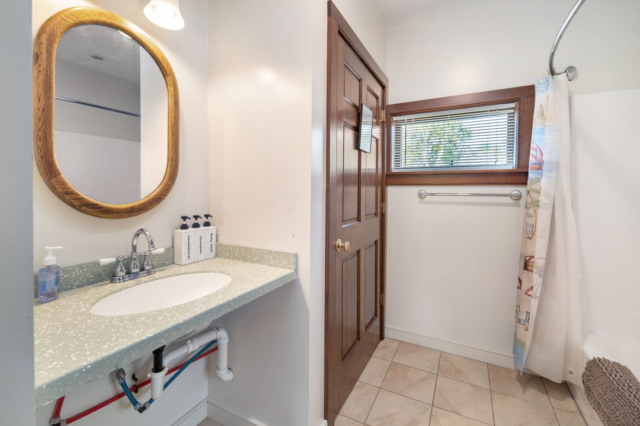 A full bathroom with a tub and shower combination.