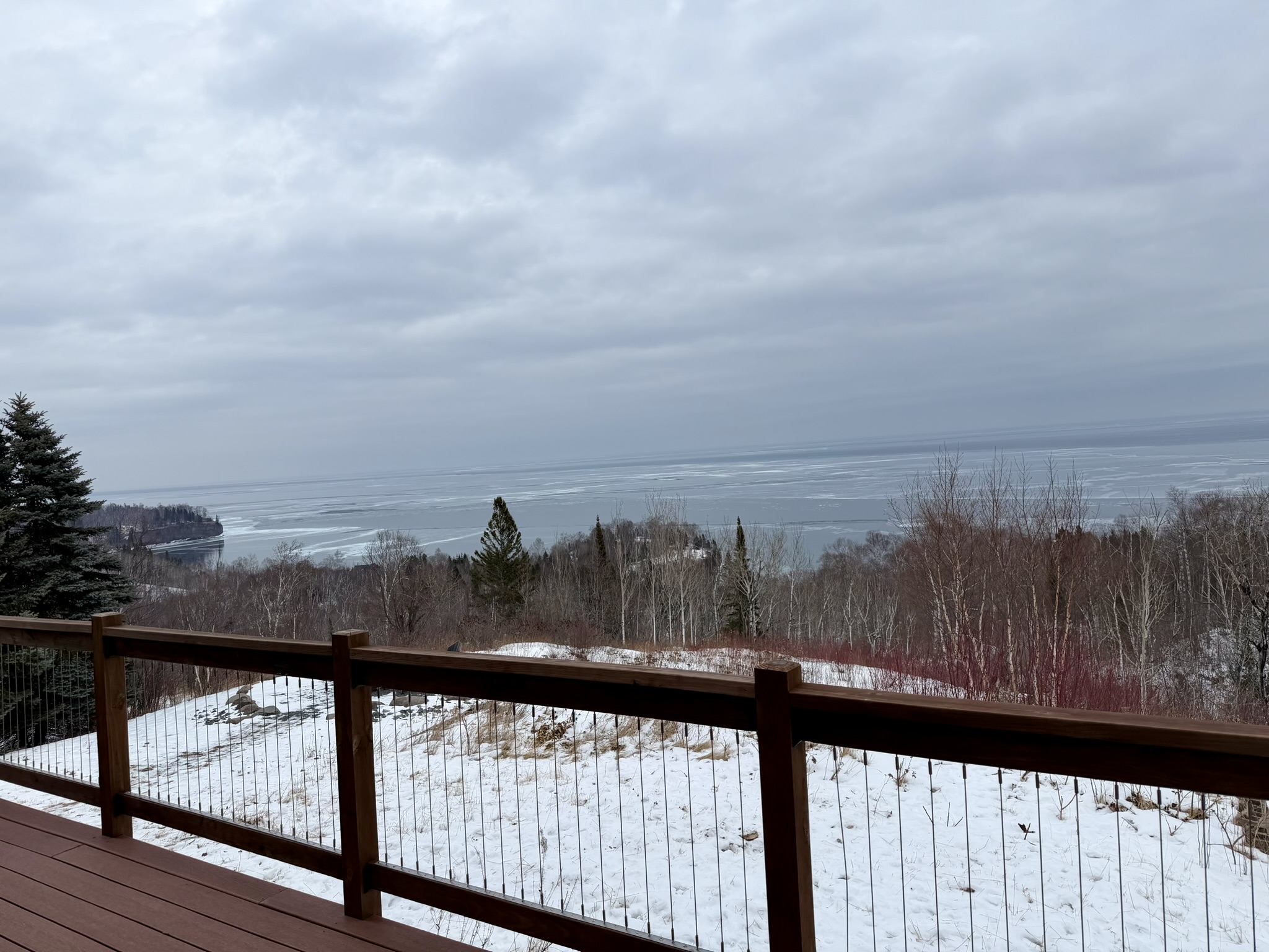 As you step on the deck the 180° Lake Superior panorama view shines, with the fire pit and chairs below, ready for sunrises, s’mores, and fresh lake air.