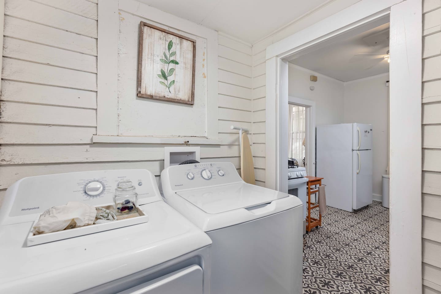 Enter home into laundry room, then enter into kitchen. 