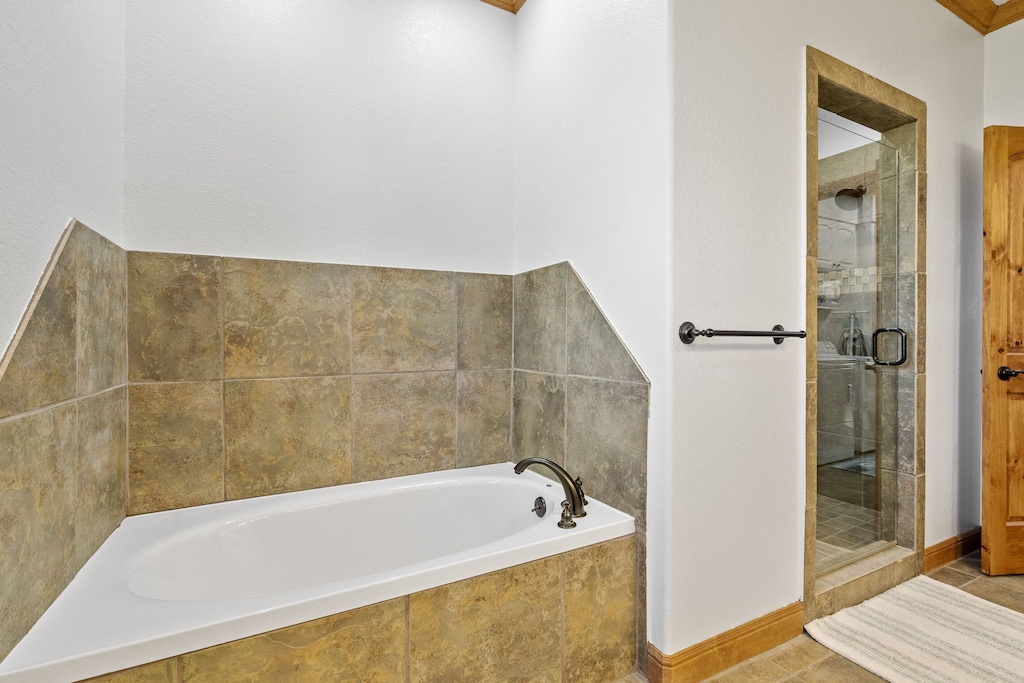 Primary bathroom with soaking tub & separate shower.