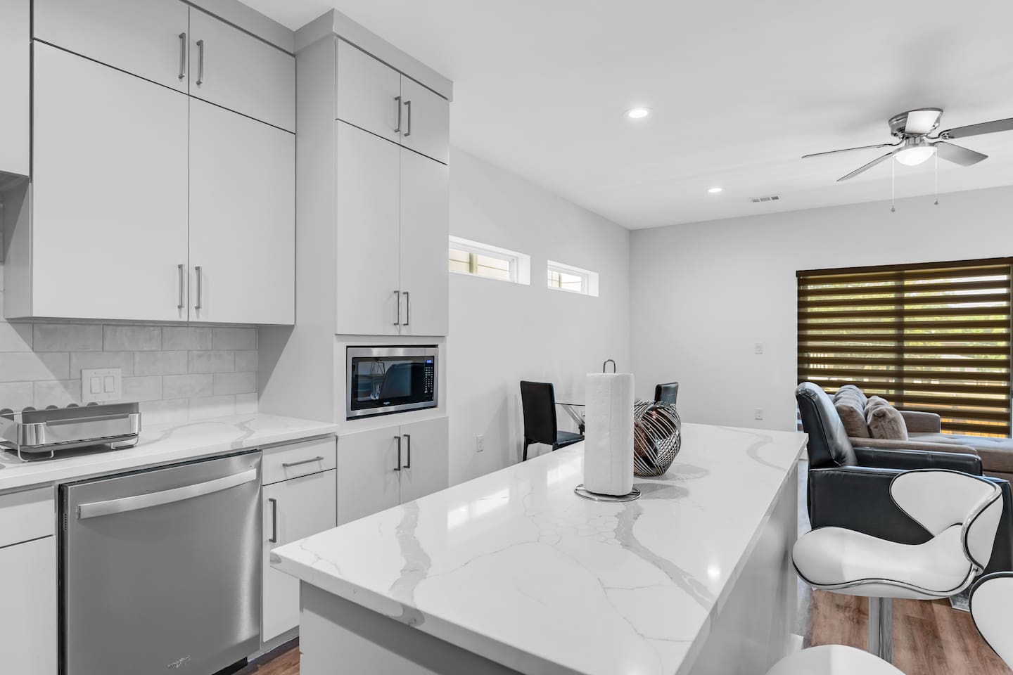Brand new, open-concept kitchen with stainless steel appliances and island.