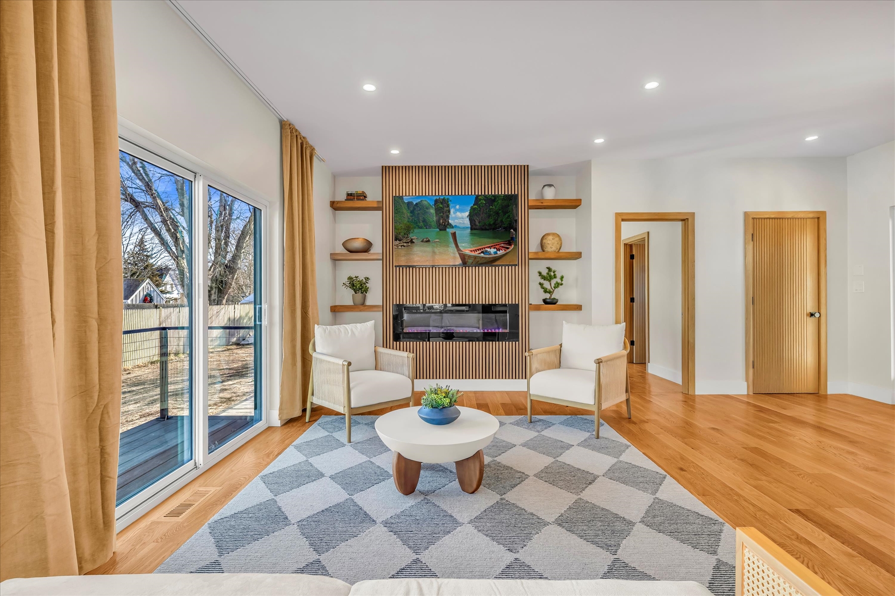 Sliders are off the living room to the backyard which will have BBQ grill, large group seating and fire pit. Yard is great for playing games. 