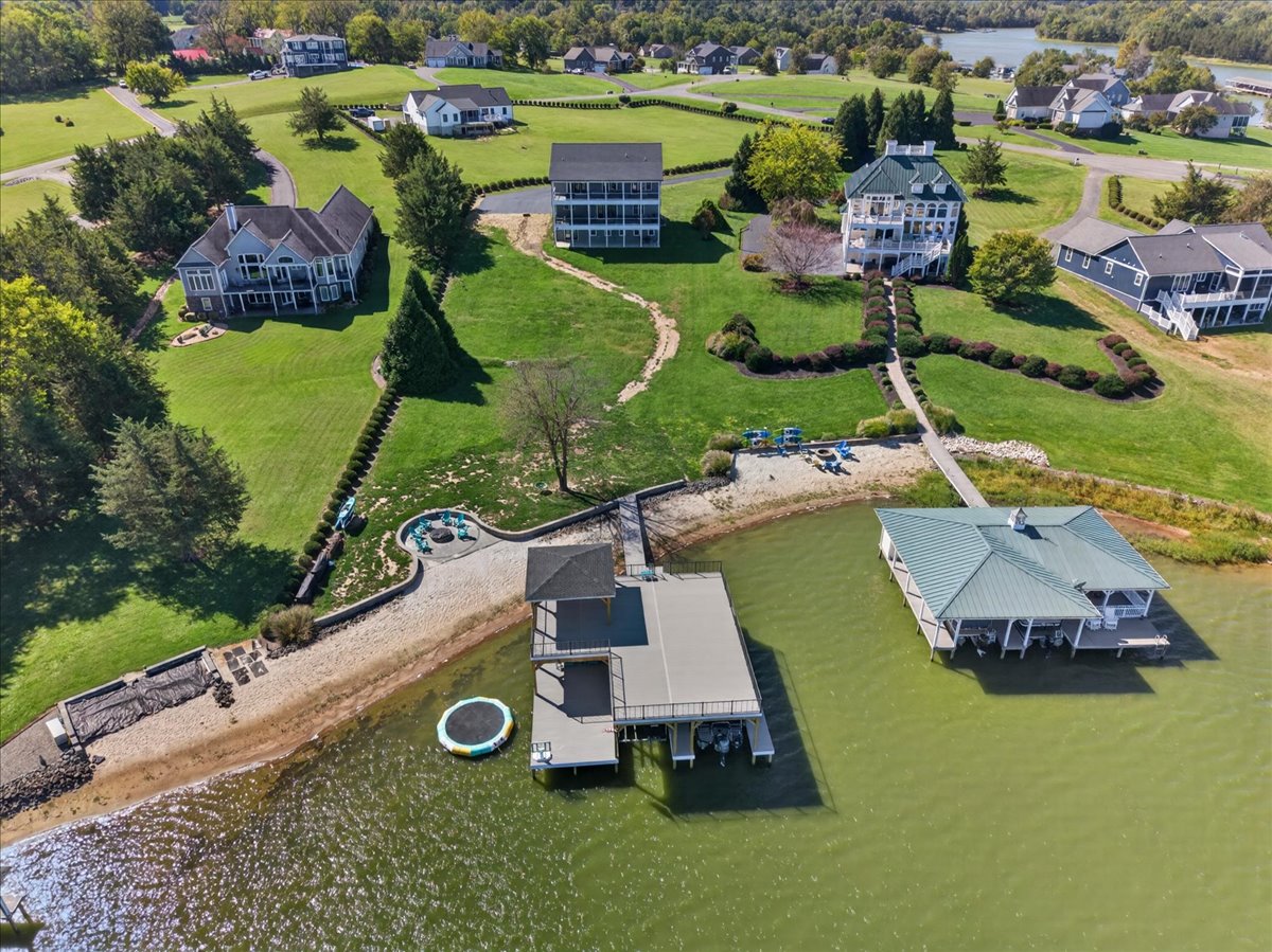 Aerial view showcasing the home’s spacious lot and proximity to the waterfront.