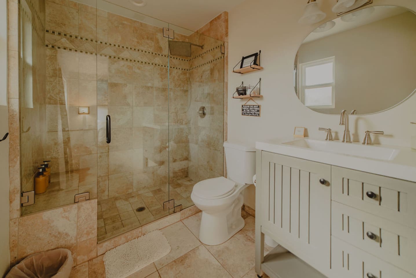 Spacious bathroom with walk-in shower and updated finishes