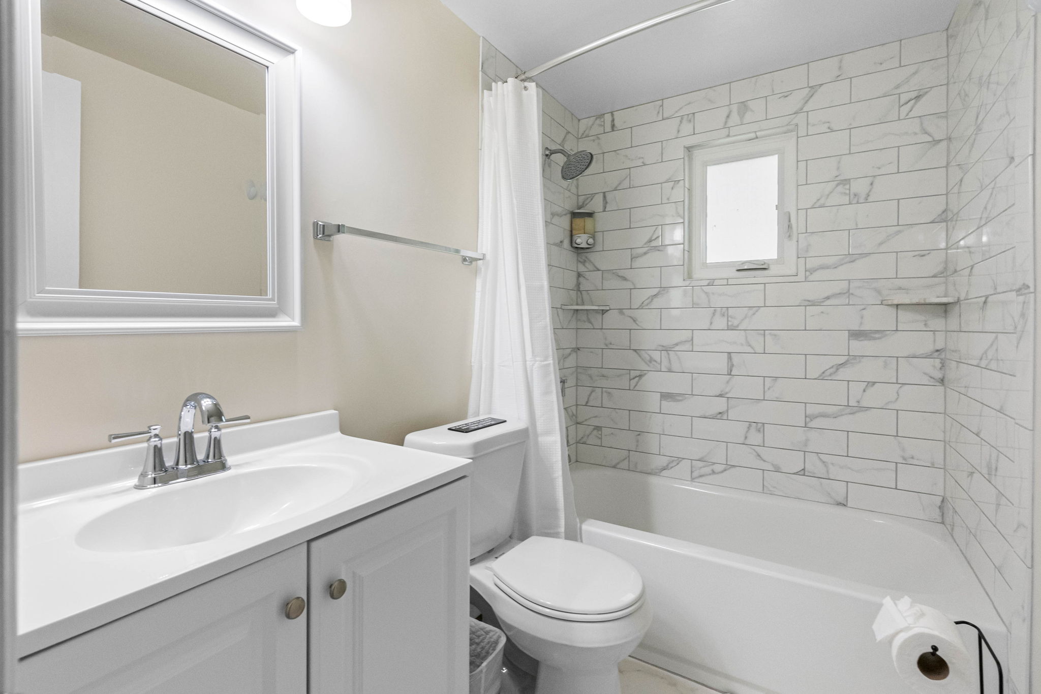 This beautifully updated full bathroom combines modern finishes with thoughtful design, offering a fresh and clean space to unwind and refresh.