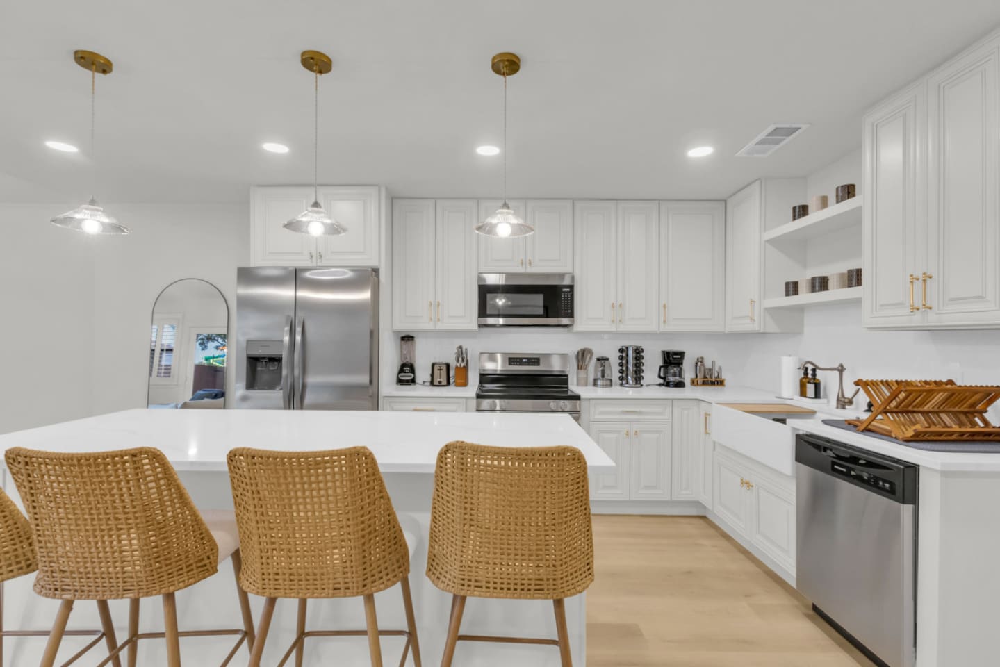 Chef-ready kitchen with dishwasher, cooking basics, dishes and cutlery, and stainless steel Frigidaire appliances. Designed for comfort during any length of stay.