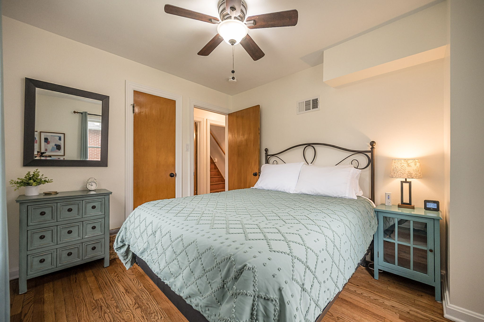 Each bedroom closet contains a blanket, fan, hangers, luggage rack, and a hamper.