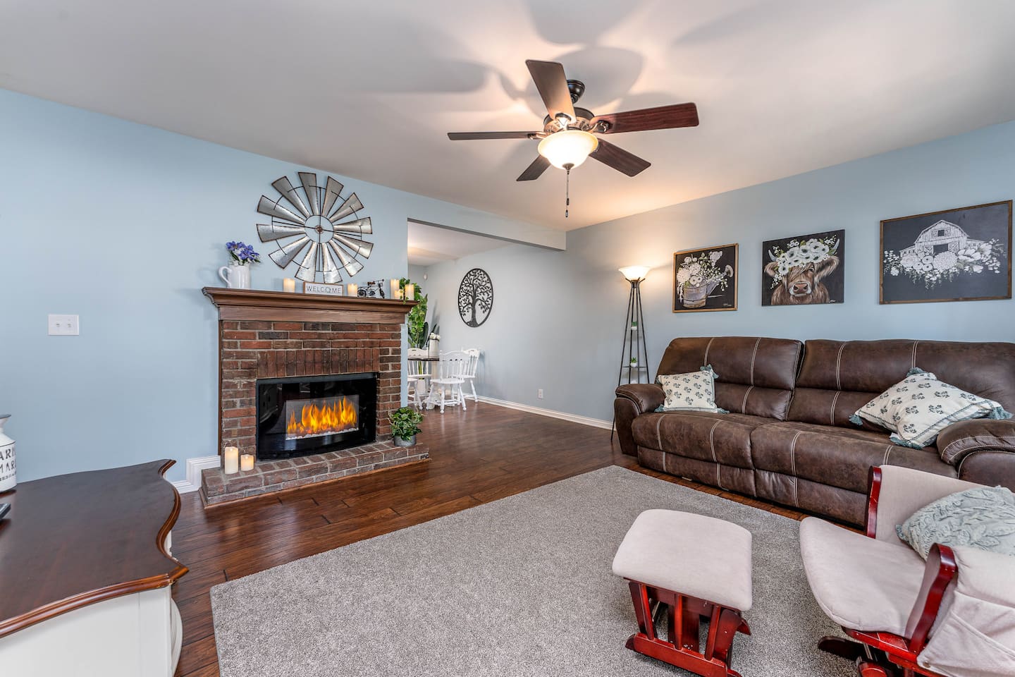 Reclining couch and electric fireplace.