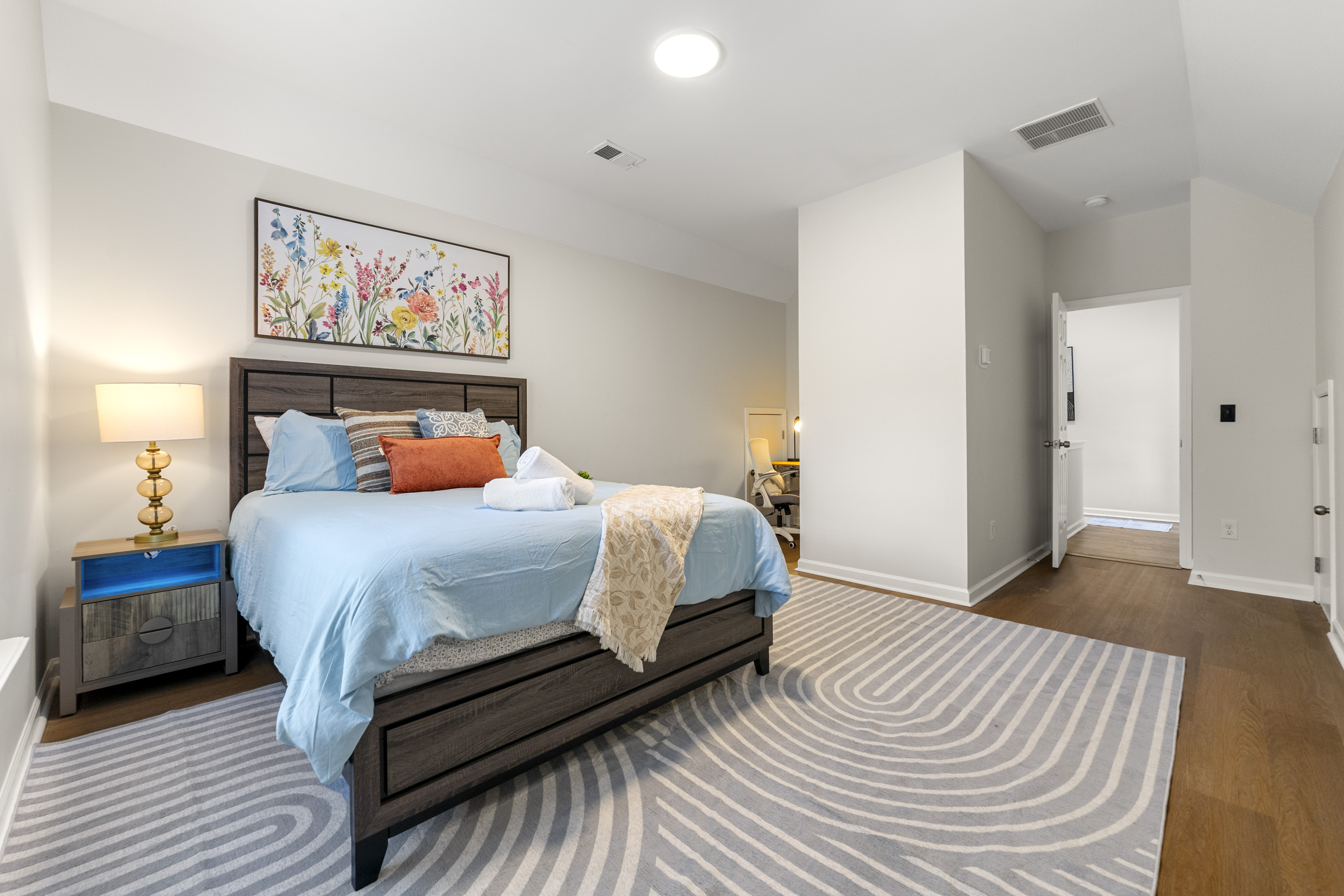 Elegant bedroom with calming tones and plush bedding for a restful night’s sleep.