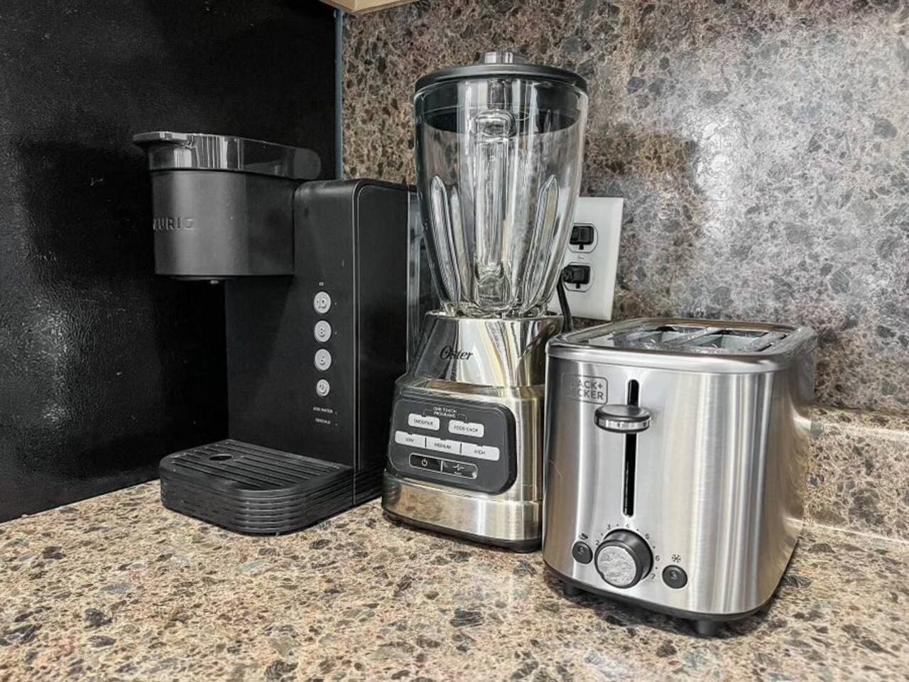 Keurig coffee maker, blender, and toaster, offering everything you need for a quick breakfast or a fresh cup of coffee.